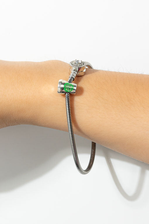 Pulsera Paloma plateada con dije